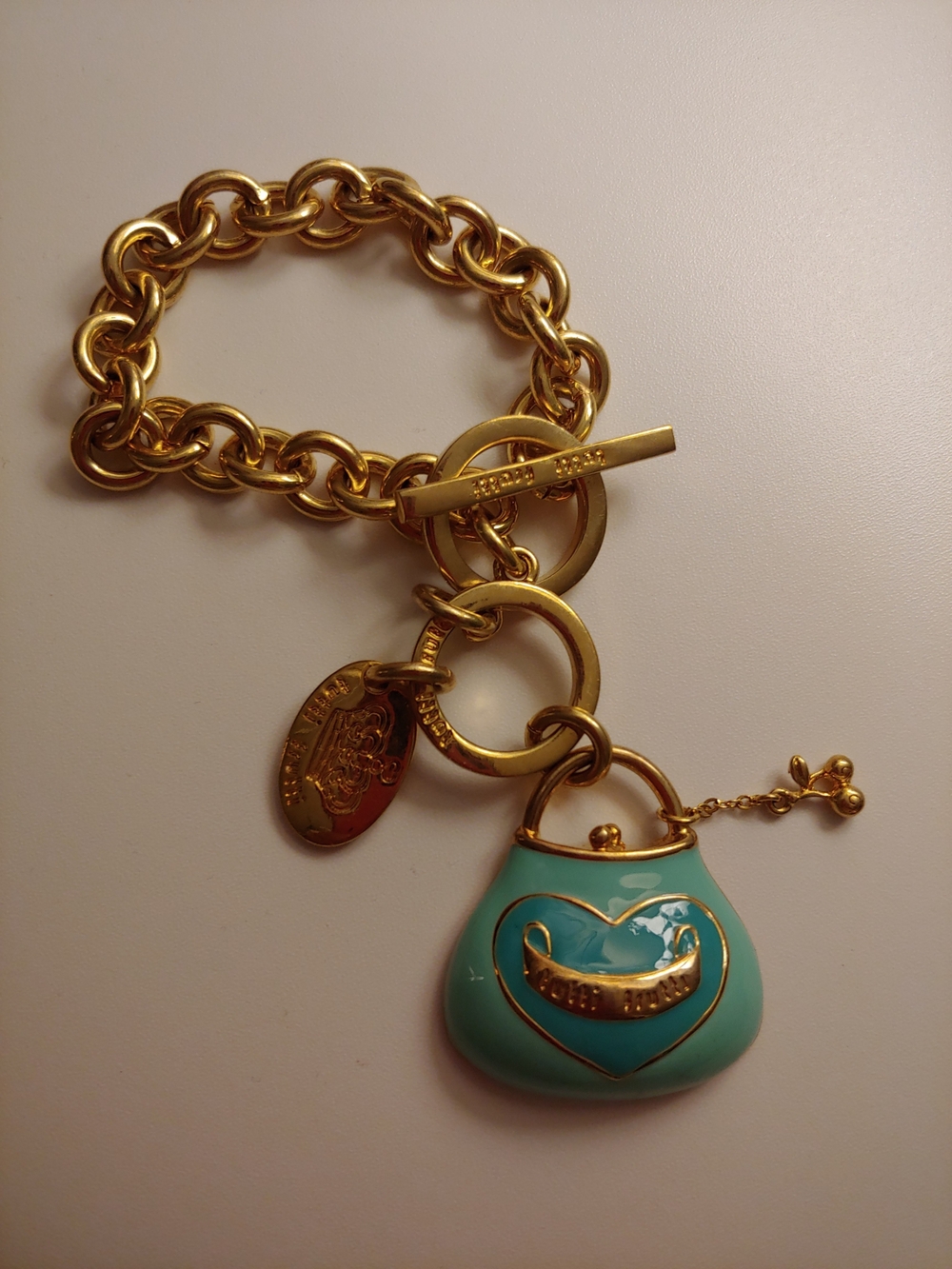 Juicy Couture Gold-Tone Chain Bracelet with Turquoise Enamel Purse Charm